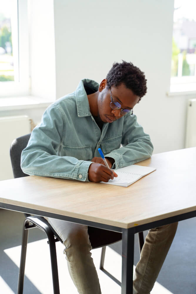full shot man studying classroom 1